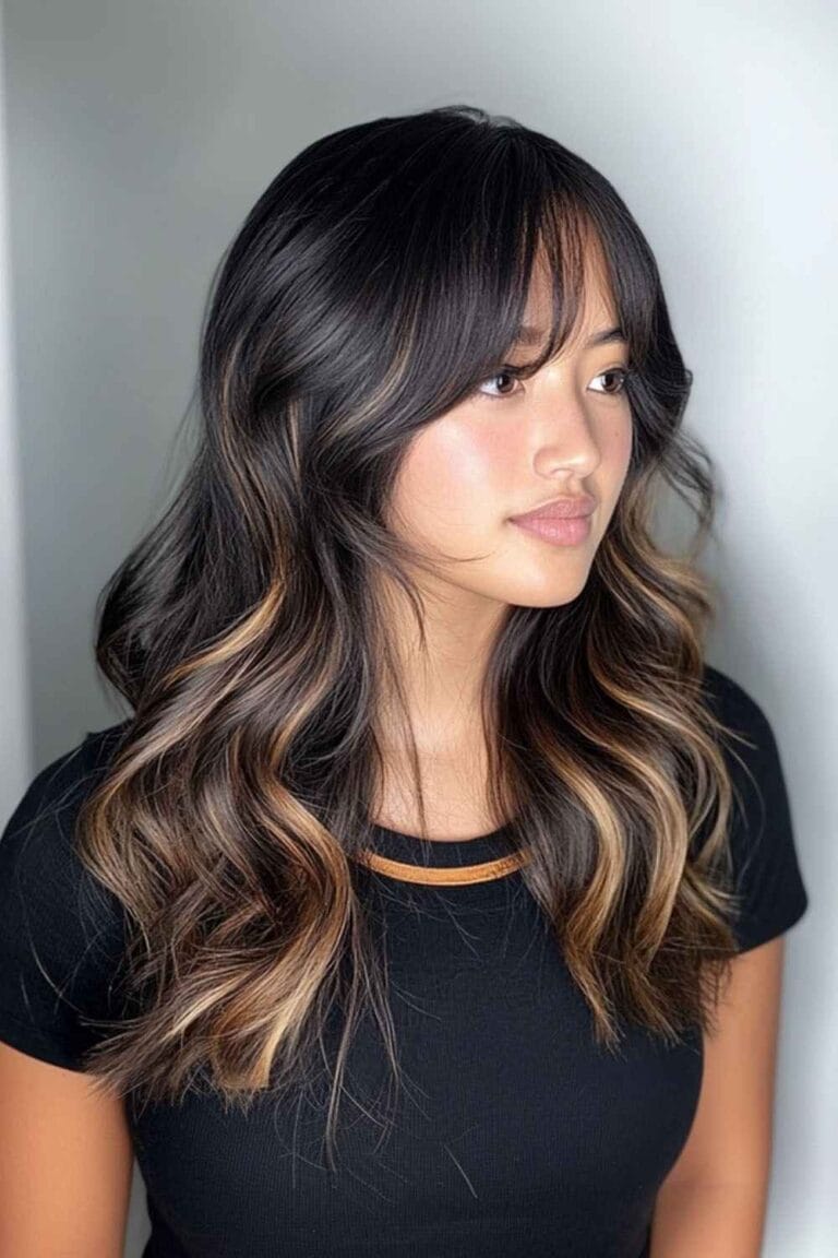 Trending Highlight Colors for Black Hair in 2025 Caramel highlights with curtain Bangs