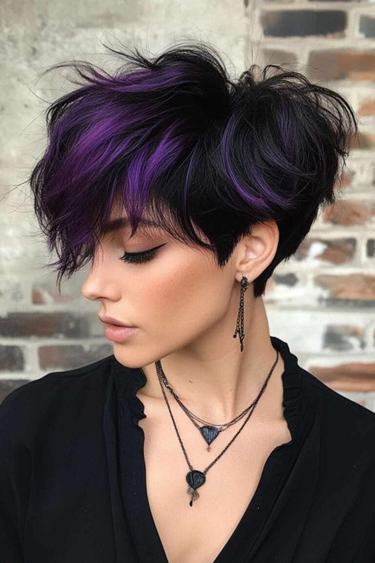 Trending Highlight Colors for Black Hair in 2025 Dark purple chunks with a messy pixie