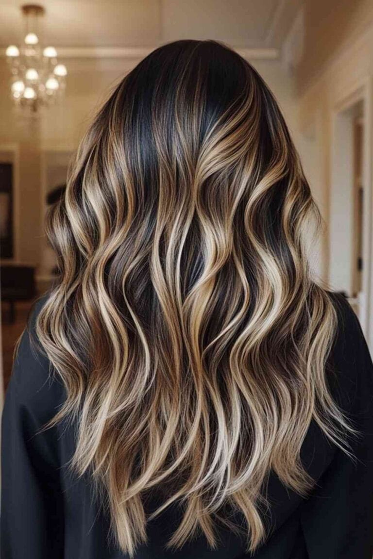 Trending Highlight Colors for Black Hair in 2025 Honey blonde streaks with beachy waves