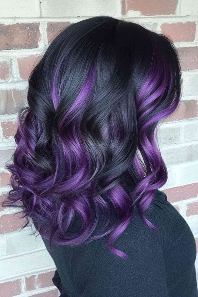 Trending Highlight Colors for Black Hair in 2025 Lilac purple accenting with easy curls
