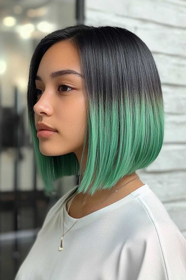 Trending Highlight Colors for Black Hair in 2025 Mint green peekaboo with straight cut