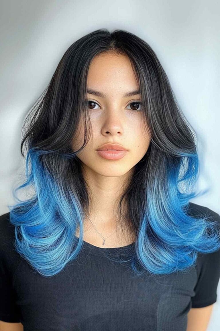 Trending Highlight Colors for Black Hair in 2025 Pastel blue ends with layering hair