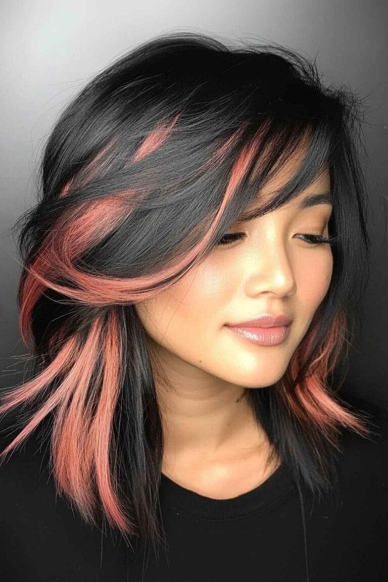 Trending Highlight Colors for Black Hair in 2025 Rose gold accents and side swept bangs