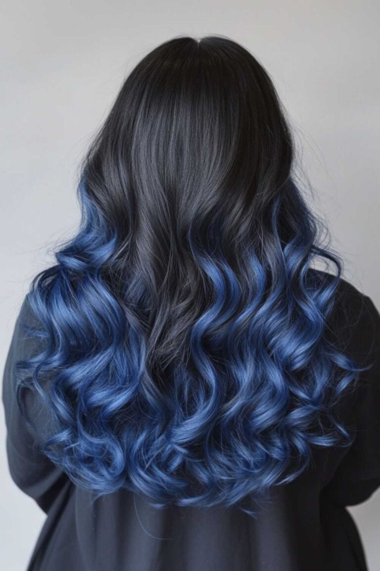Trending Highlight Colors for Black Hair in 2025 Sapphire blue ombre with long waves 1